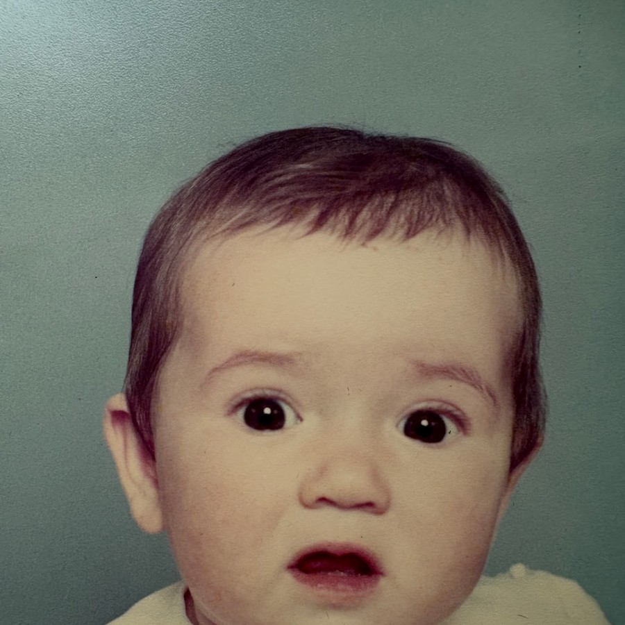 Melanie Challenger as a baby, photographed in a studio portrait.